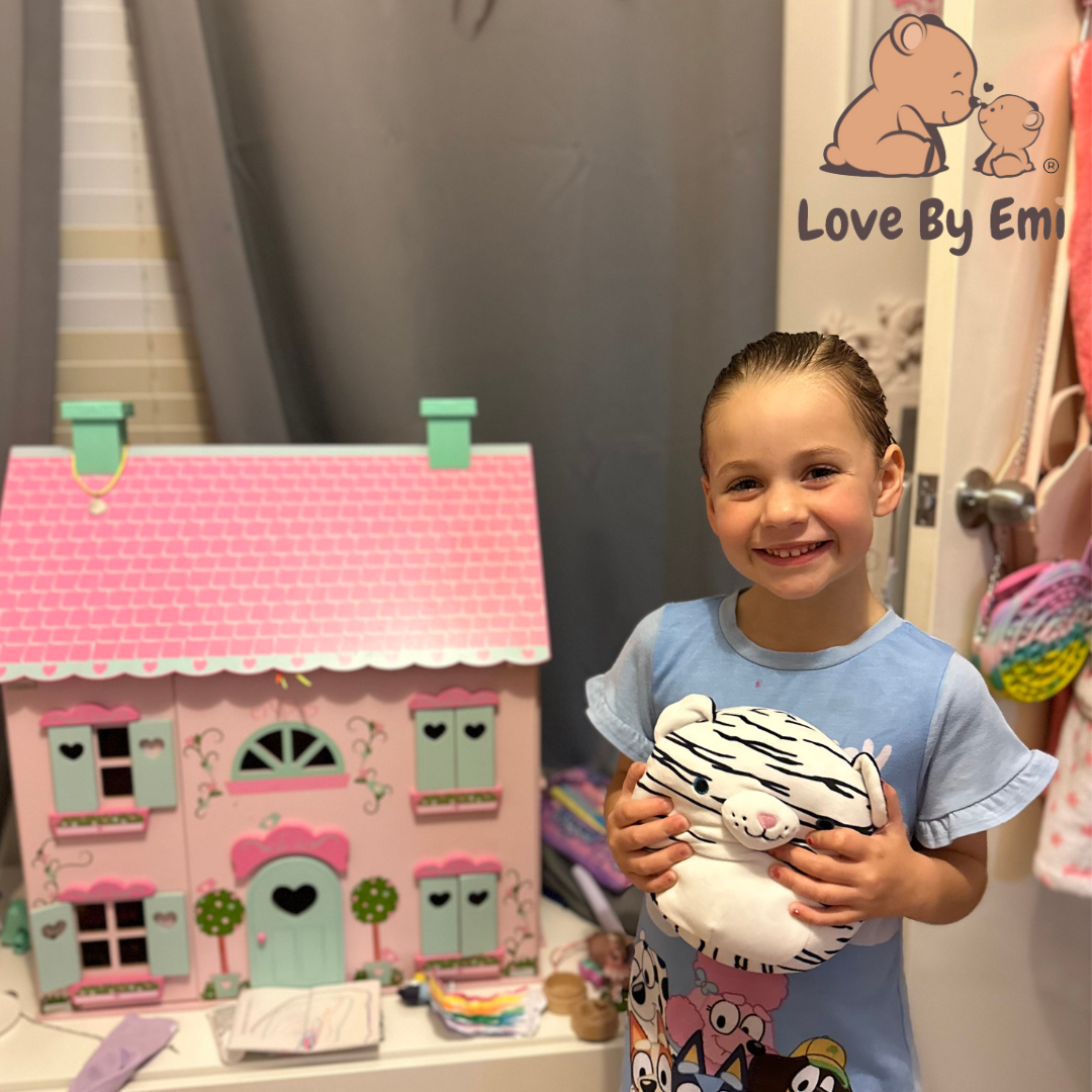 Product image of beautiful white tiger squishy made by love by emi held by cute girl looking so happy with her new toy